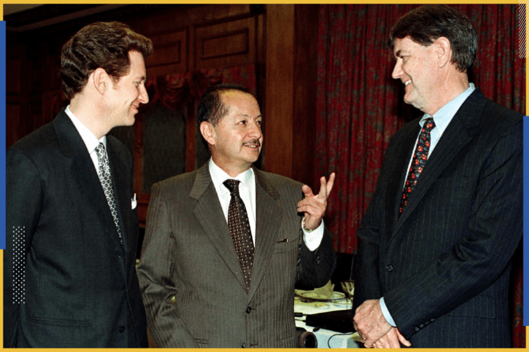 Tom Kaplan (L) and Keith Hulley (R), President and Vice-President of Apex Silver Mine converse with their representative in Bolivia, Jhonny Delgado(C) during an act in La Paz in which the company's announcement February 18, that it will invest 237 million dollars in the reopening of the silver mine of San Cristobal, some 600 kms south of La Paz. The mine is one of the largest in the world .