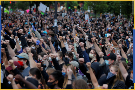 Demonstrators raise their fists as they take a knee for 8 minutes 46 seconds, the length of time George Floyd was held down with a knee on his neck by a Minneapolis Police officer, during a protest against racial inequality in the aftermath of George Floyd's death, in Boston, Massachusetts, U.S., June 7, 2020. REUTERS/Brian Snyder