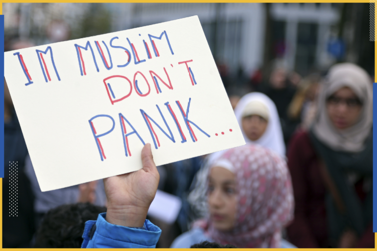 A demonstrator holds up a sign reading "I'm Muslim don't panic" during a protest against Islamophobia in front of the Brussels' Justice Palace October 26, 2014. REUTERS/Francois Lenoir (BELGIUM - Tags: CIVIL UNREST RELIGION)