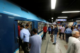 Egyptians wait to board at Al Shohadaa "Martrys" metro station in Cairo