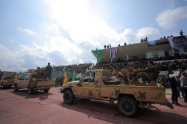Kurdish fighters from the People's Protection Units (YPG) take part in a military parade as they celebrate victory over the Islamic state, in Qamishli