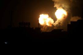 Flame and smoke are seen during Israeli air strikes in the southern Gaza Strip