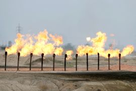 Flames are seen at a station in al-Zubair oil field, near Basra