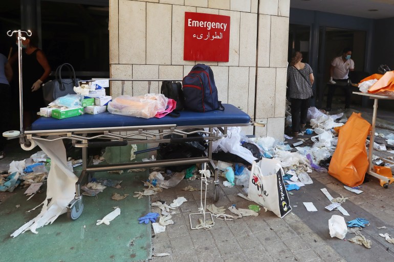 Protective gloves are scattered at a damaged hospital following Tuesday's blast in Beirut