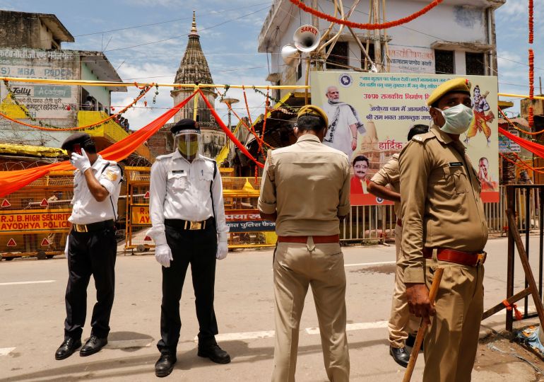 Policemen stand guard before the arrival of India's Prime Minister Narendra Modi ahead of the foundation laying ceremony for a Hindu temple in Ayodhya