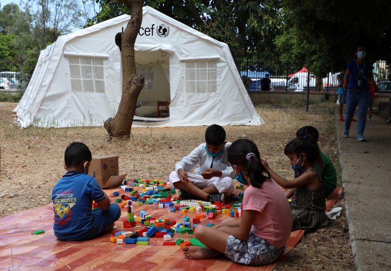 Children play outisde a UNICEF tent in Beirut