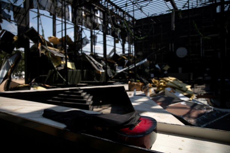 A guitar is seen inside the destroyed "AHM" club, in the aftermath of a massive explosion at the port area, in Beirut