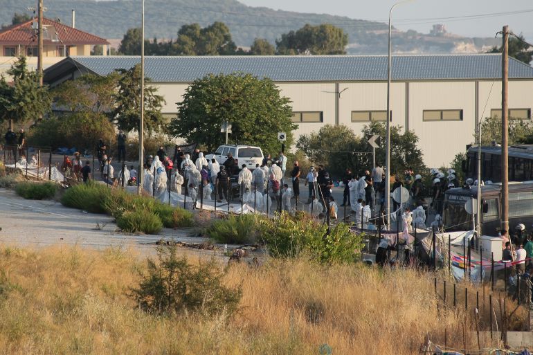 Refugees move to new camp in Lesbos