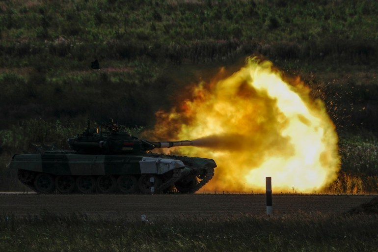 A T-72 B3 tank operated by a crew from Armenia fires during the Tank Biathlon competition at the International Army Games 2018 in Alabino outside Moscow
