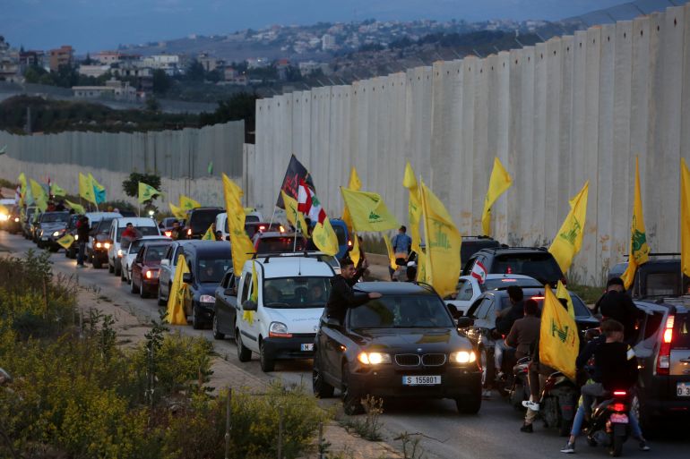Supporters of Lebanon's Hezbollah leader Sayyed Hassan Nasrallah ride in a convoy in the village of Kfar Kila