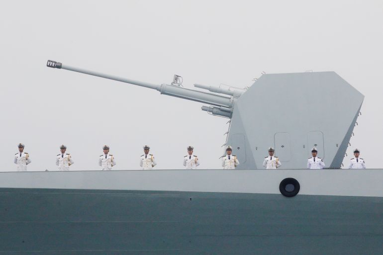 Chinese Navy's destroyer Taiyuan takes part in a naval parade off the eastern port city of Qingdao, to mark the 70th anniversary of the founding of Chinese People's Liberation Army Navy