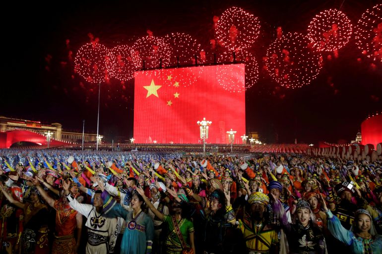Fireworks explode over Tiananmen Square as performers take part in the evening gala marking the 70th founding anniversary of People's Republic of China