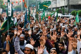 People chant slogans against the satirical French weekly newspaper Charlie Hebdo, which reprinted a cartoon of the Prophet Mohammad, during a protest in Karachi