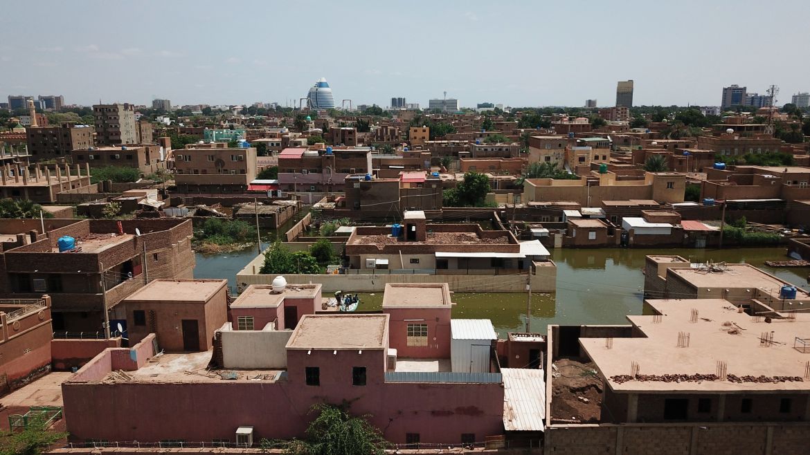 An aerial view shows buildings and roads submerged by floodwaters near the Nile River in South Khartoum