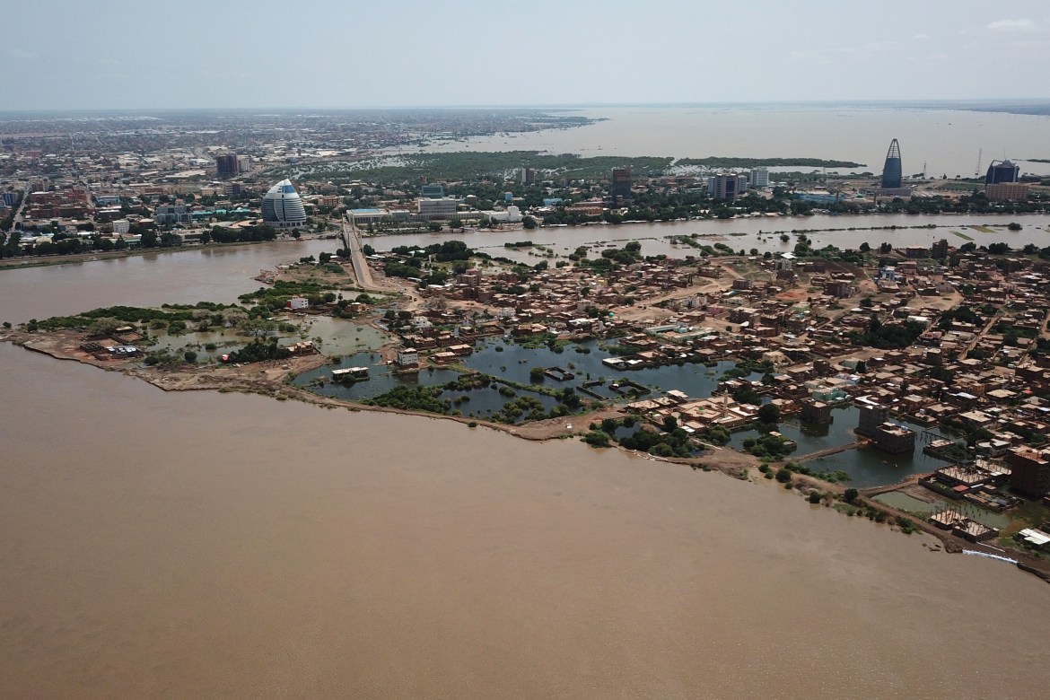 An aerial view shows buildings and roads submerged by floodwaters near the Nile River in South Khartoum
