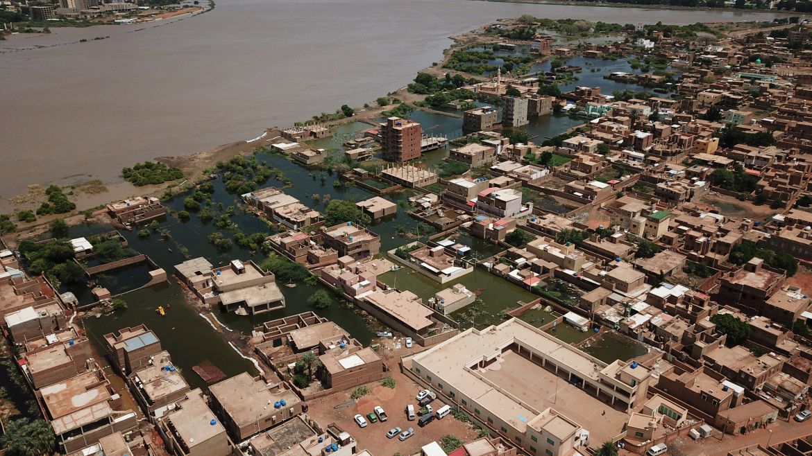 An aerial view shows buildings and roads submerged by floodwaters near the Nile River in South Khartoum