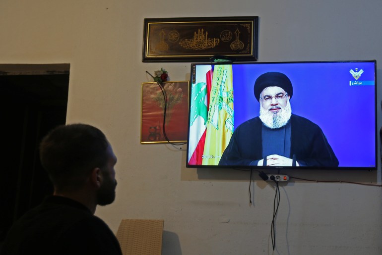A man watches Lebanon's Hezbollah leader Sayyed Hassan Nasrallah speaking on television, inside a shop in Houla A man watches Lebanon's Hezbollah leader Sayyed Hassan Nasrallah speaking on television, inside a shop in Houla, southern Lebanon September 29, 2020. REUTERS/Aziz Taher