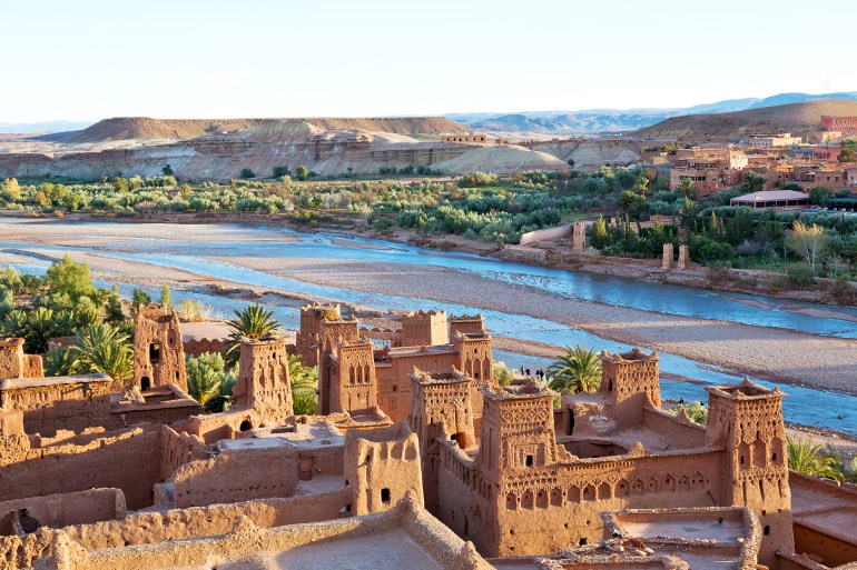 africa; ait; ancient; architecture; benhaddou; blue; brown; building; casbah; castle; city; country; culture; desert; exterior; fort; fortification; heritage; hill; historic; history; home; horizontal; houses; kasbah; landscape; medieval; morocco; mountain; old; ouarzazate; palm; panoramic; protection; river; sahara; sand; sky; summer; sunset; sunshine; tourism; tower; town; traditional; travel; tree; unesco; village; wall