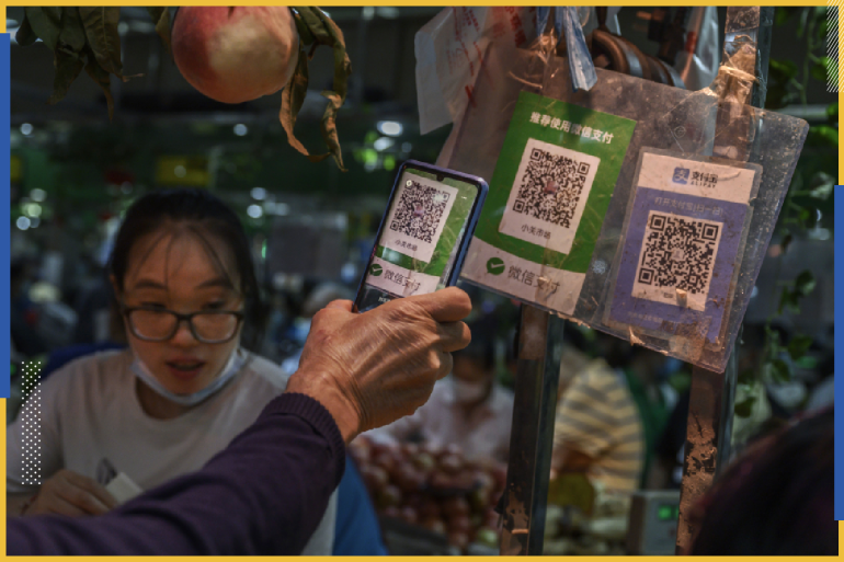 BEIJING, CHINA - SEPTEMBER 19: A Chinese customer uses his mobile to pay via a QR code with the WeChat app at a local market on September 19, 2020 in Beijing, China. The Trump administration announced Friday its intentions to ban the popular Chinese mobile app from U.S. app stores as of midnight on Sunday, marking an escalation in tensions with China on tech issues. The U.S. government said it also plans to prevent American companies from processing transactions made via the app. (Photo by Kevin Frayer/Getty Images)