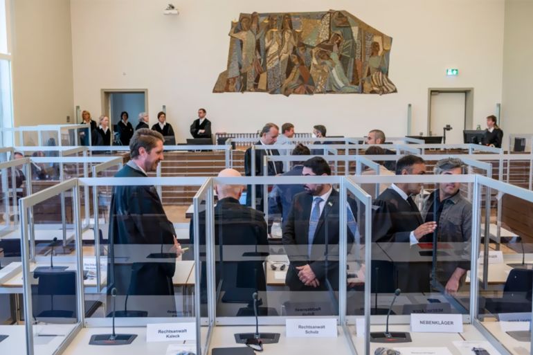 Joint plaintiffs are seen at the courtroom prior to the start of a trial against two Syrian defendants accused of state-sponsored torture in Syria, on April 23, 2020 in Koblenz, Germany. THOMAS LOHNES/POOL/AFP VIA GETTY IMAGES