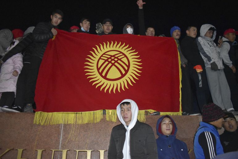 Protesters gather around the Ala-Too Square in Bishkek