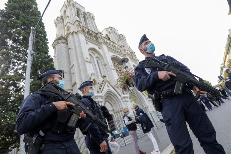 Police officers stand near Notre Dame church, where a knife attack took place, in Nice, France October 29, 2020. REUTERS/Eric Gaillard/Pool