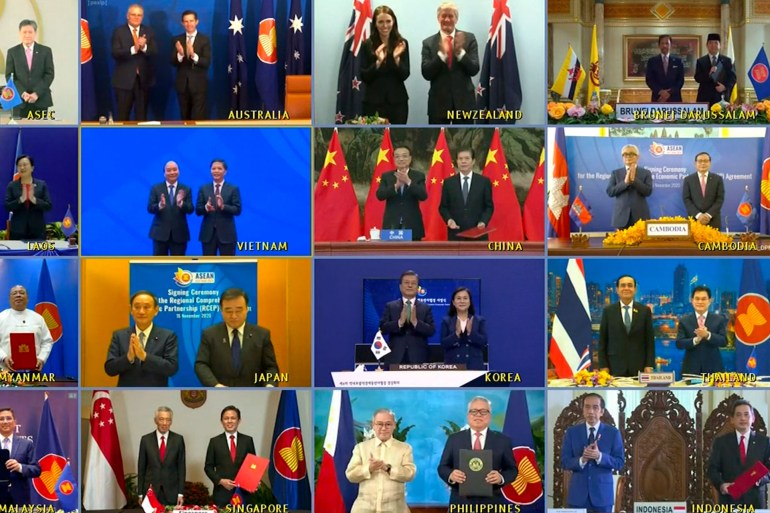 epa08821197 A handout image of a video conference made available by the Vietnam News Agency (VNA) shows leaders and trade ministers of 15 Asia-Pacific nations posing for a virtual group photo during the 4th Regional Comprehensive Economic...
