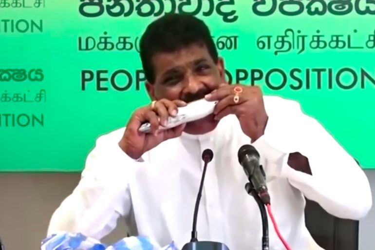 Sri Lankan politician eats raw fish to prove it won't give you Covid after conspiracy frenzy
