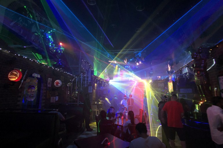 People are seen in a night club in Dubai, United Arab Emirates