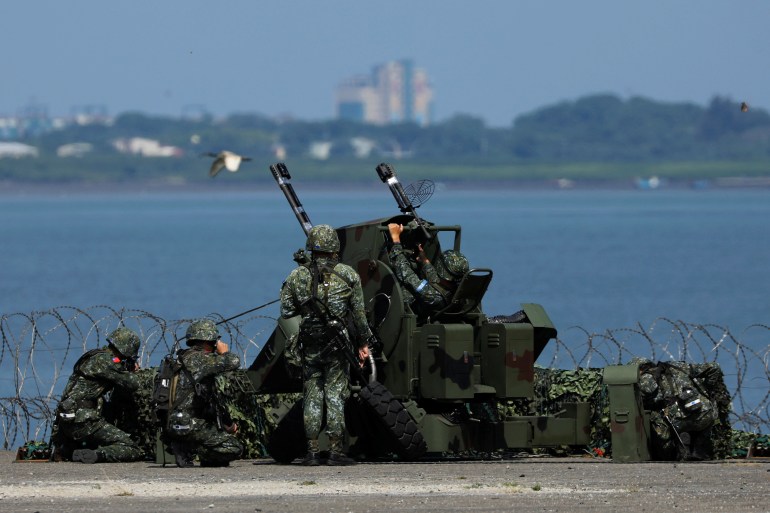 Taiwanese soldiers take part in Han Kuang military drill simulating the China's People's Liberation Army (PLA) invading the island, in New Taipei City