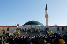 Muslims pray for victims of a gun attack during their Friday prayer at a mosque in Vienna