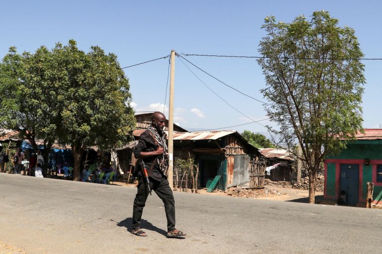 A member of the Amhara Special Force patrols a street in Soroka village in Amhara region near a border with Tigray