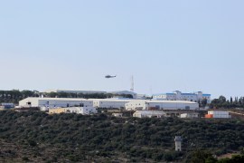 An aircraft flies over a base for U.N. peacekeepers of the United Nations Interim Force in Lebanon (UNIFIL) in Naqoura
