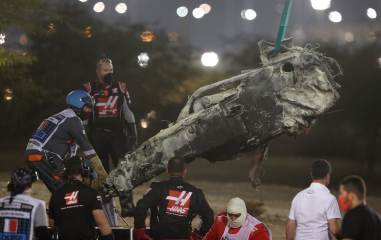 Formula One F1 - Bahrain Grand Prix - Bahrain International Circuit, Sakhir, Bahrain - November 29, 2020 General view as the burnt wreckage of the car of Haas' Romain Grosjean is removed from the track following a crash Pool via REUTERS/Tolga Bozoglu TPX IMAGES OF THE DAY
