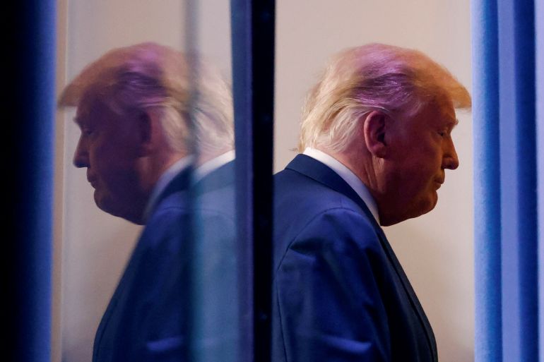 U.S. President Donald Trump is reflected as he departs after speaking about the 2020 U.S. presidential election results in the Brady Press Briefing Room at the White House in Washington, U.S., November 5, 2020. REUTERS/Carlos Barria TPX IMAGES OF THE DAY