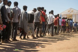 epaselect epa08858053 Ethiopian refugees from Tigray region wait in line to receive aid at the Um Rakuba refugee camp, the same camp that hosted Ethiopian refugees during the famine in the 1980s, some 80 kilometres from the Ethiopian-Sudan border...
