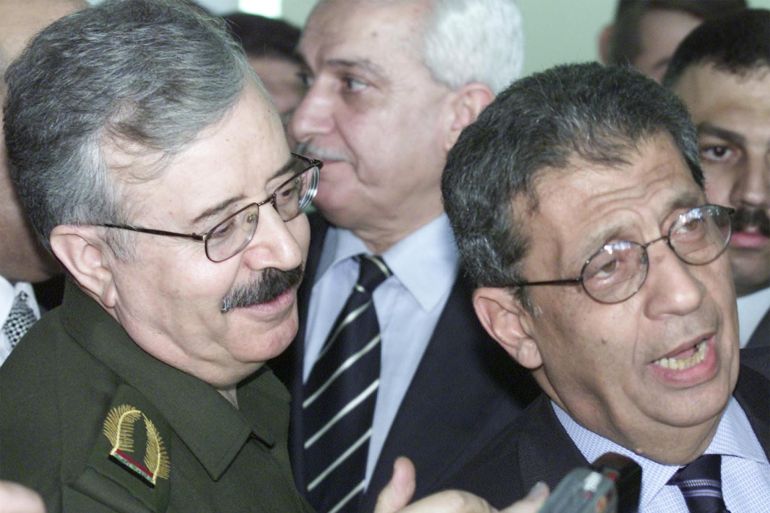 The head of Arab League Amr Moussa (R) with Iraqi Foreign Minister Naji Sabri during a press conference in Saddam airport in Baghdad January 18, 2002. REUTERS/Faleh Kheiber fk