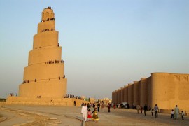 Residents visit the Spiral Minaret of the Great Mosque in Samarra