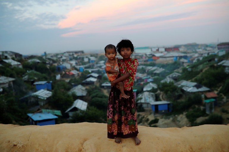 Rohingya refugee children pose for a picture at the Balukhali camp in Cox's Bazar