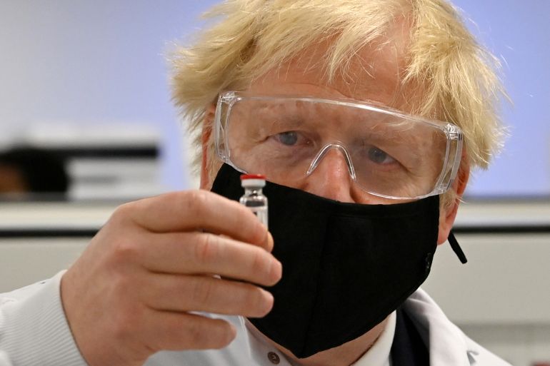 Britain's PM Johnson sees coronavirus vaccine manufacturing process in Wrexham