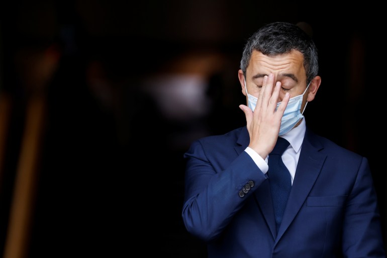 French Interior Minister Gerald Darmanin touches his face ahead of a visit of the French President Emmanuel Macron about the fight against separatism at the Seine-Saint-Denis prefecture headquarters in Bobigny, near Paris, France October 20, 2020. Ludovic Marin/Pool via REUTERS