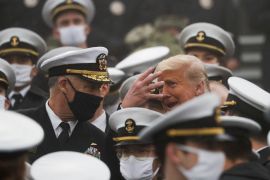 U.S. President Trump gestures as he stands among U.S. Navy cadets during the annual Army-Navy collegiate football game at Michie Stadium, in West Point, New York, U.S., December 12, 2020. REUTERS/Tom Brenner