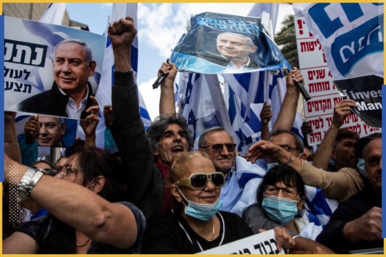 Supporters of Israeli Prime Minister Benjamin Netanyahu take part in a protest outside the Prime Minister's Residence, on the day when Netanyahu's corruption trial starts, in Jerusalem May 24, 2020. Heidi levine/Pool via REUTERS