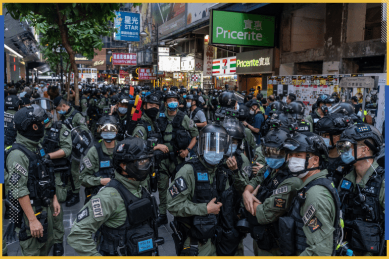 HONG KONG, CHINA - OCTOBER 01: Riot police secure an area on national day in a shopping area on October 1, 2020 in Hong Kong, China. Hong Kong police arrested over 60 for unauthorised assembly after conducting stop and search operation as 6000 officers were deployed in force to prevent any protests on National Day. (Photo by Anthony Kwan/Getty Images)