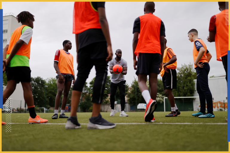 A football academy at a Paris suburb hold training for disadvantaged youths while making sure social distancing measures are in place, following the outbreak of the coronavirus disease (COVID-19), Paris, France, May 22, 2020. REUTERS/Christian Hartmann