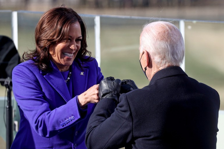 Kamala Harris bumps fists with Joe Biden after being sworn in as Vice President of the United States during the inauguration on the West Front of the U.S. Capitol in Washington, U.S., January 20, 2021. REUTERS/Jonathan Ernst/Pool