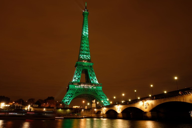 epa08954866 (FILE) - The Eiffel Tower is illuminated in green to celebrate the ratification of the COP21 (Conference of the Parties Climate Conference) climate change agreement in Paris, France, 04 November 2016 (reissued 21 January 2021). US...