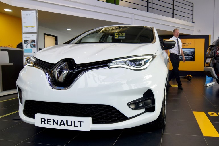 Steve Tomlin shows the new version of Renault's small battery electric Zoe model car in Reading