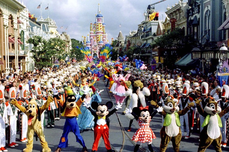 Mickey Mouse leads other Disney characters in dancing to the music of the Florida A&M marching band ..