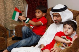 Ahmed Mansoor, one of the five political activists pardoned by the United Arab Emirates, plays with his children as he speaks to Reuters in Dubai Ahmed Mansoor, one of the five political activists pardoned by the United Arab Emirates, plays with his children as he speaks to Reuters in Dubai November 30, 2011. The UAE pardoned on Monday the five activists who were convicted a day earlier for insulting UAE leaders. REUTERS/Nikhil Monteiro (UNITED ARAB EMIRATES - Tags: CRIME LAW POLITICS)